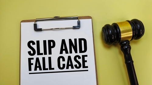 Clipboard with the words Slip and Fall Case next to a judge’s gavel.