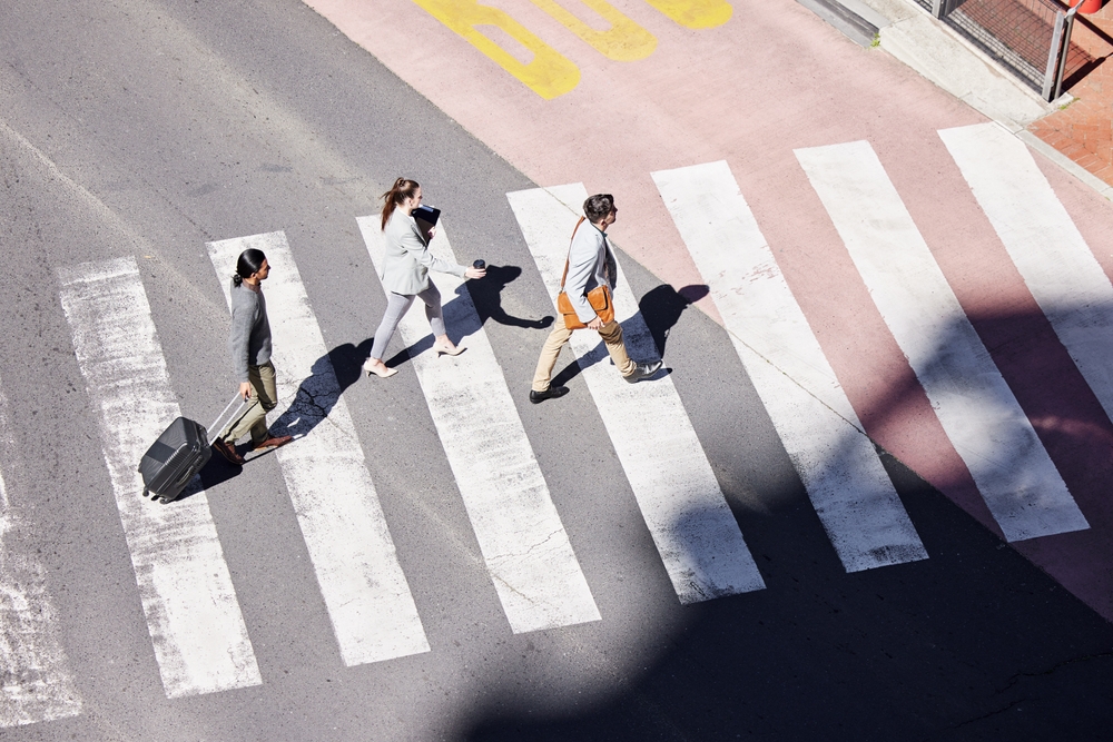 Overhead view of pedestrians walking in crosswalk illustrating case handled by Dallas pedestrian accident lawyer