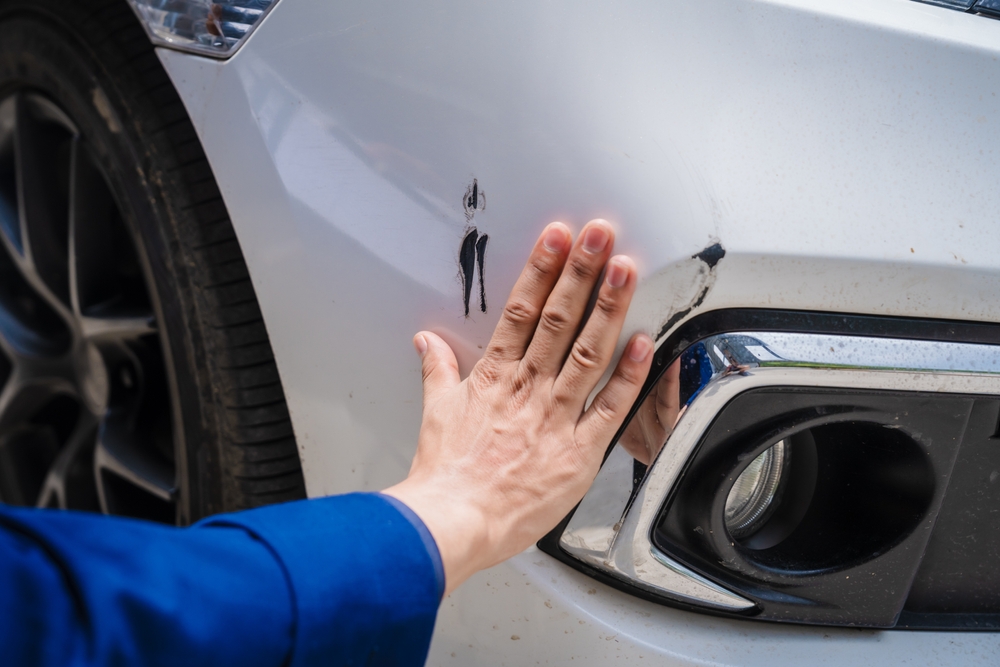 Close-up of vehicle damage evaluated by a Dallas Rideshare Accident Lawyer